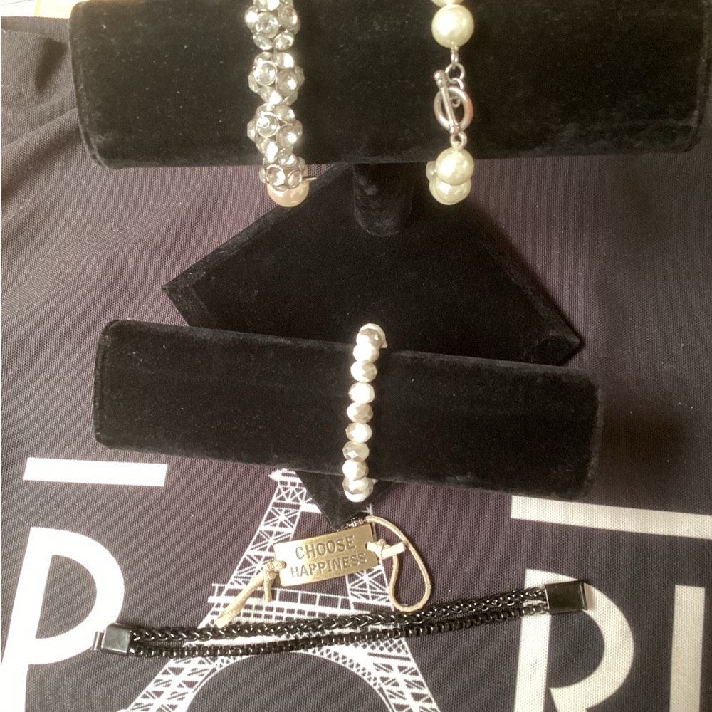 Five bracelets, 3 faux elegant pearl/ silver, 1 metal, 1 drawstring.